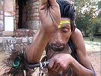 fakir gives blessings after receiving alms